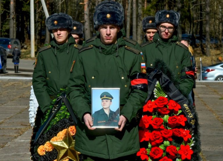 Fellow soldiers carry wreathes and a picture of 20-year-old Nikita Avrov, killed in late March at Izyum in eastern Ukraine