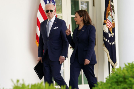 U.S. President Joe Biden and Vice President Kamala Harris speak as they walk into the Oval Office after an event to announce measures by Biden's administration to fight ghost gun crime, at the White House, in Washington, U.S., April 11, 2022. 