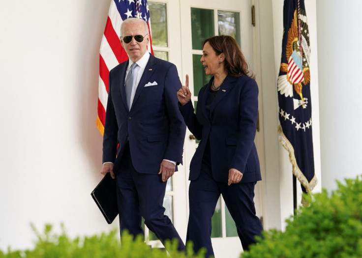 U.S. President Joe Biden and Vice President Kamala Harris speak as they walk into the Oval Office after an event to announce measures by Biden's administration to fight ghost gun crime, at the White House, in Washington, U.S., April 11, 2022. 