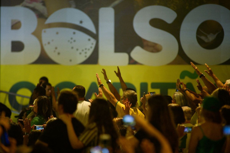Supporters of Brazil's President Jair Bolsonaro take part in an event with members of the Liberal Party and supporters as Bolsonaro presents his candidacy for the next presidential election, in Brasilia, Brazil, March 27, 2022.