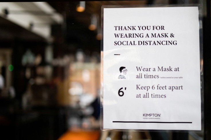 A sign is seen at a dining area that has been modified to prevent the spread of coronavirus disease (COVID-19) at the Kimpton Hotel Monaco in Philadelphia, Pennsylvania, U.S., April 7, 2021.  