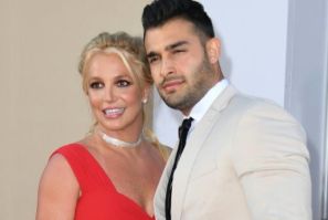 Britney Spears (L) and boyfriend Sam Asghari are expecting a child, says the pop star