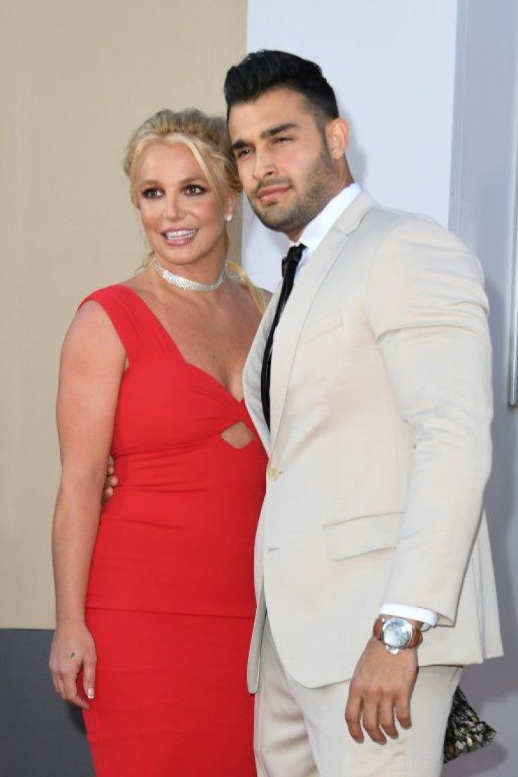 Britney Spears (L) and boyfriend Sam Asghari are expecting a child, says the pop star