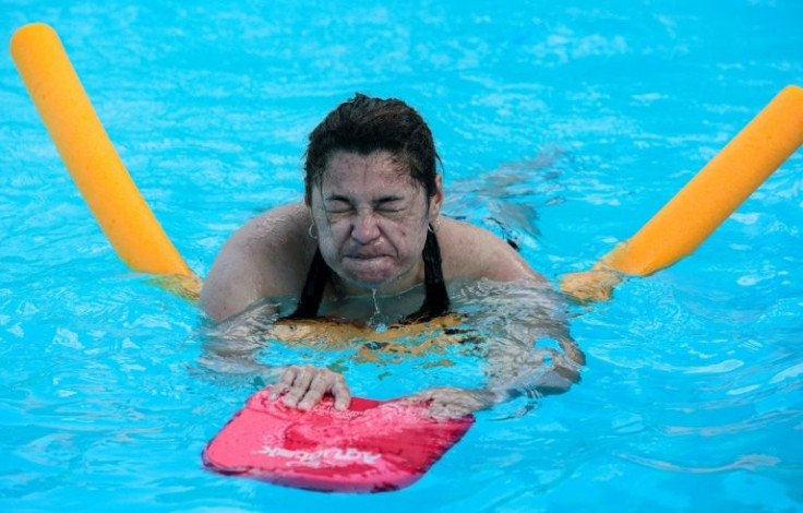 Berta Calderon is among the students of swimming coach Mario Venerio, helping Nicaraguan would-be migrants prepare for the dangerous crossing of the Rio Bravo