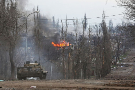 An armoured vehicle of pro-Russian troops is seen in the street during Ukraine-Russia conflict in the southern port city of Mariupol, Ukraine April 11, 2022. 
