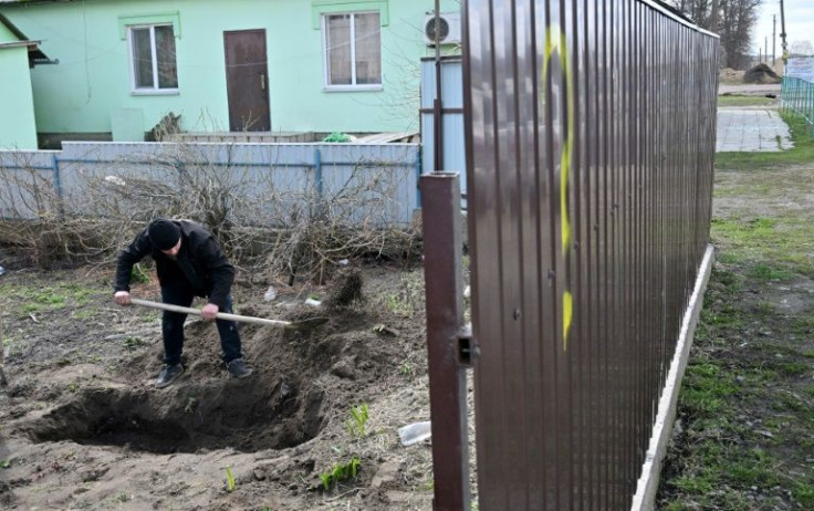 All the men were buried by their fellow Ukrainians. But villagers say they were killed by Russians