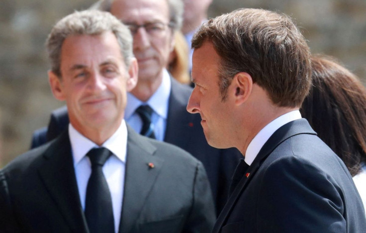 Former French President Nicolas Sarkozy and French President Emmanuel Macron arrive at a traditional annual ceremony at the Mont-Valerien, a memorial for the French who fought against the Nazis and those who were killed by the occupying forces, in Suresne