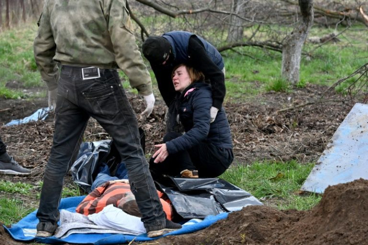 The body of a civilian was exhumed from a shallow grave near in the village of Andriivka in the Kyiv region