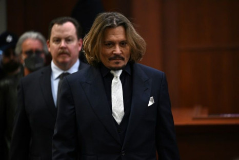 US actor Johnny Depp walks into the courtroom for the start of the defamation trial against his former wife Amber Heard