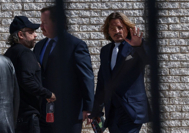 Johnny Depp reenters the Fairfax County Judicial Center following a break during the defamation case against Amber Heard in Fairfax, Virginia, U.S., April 12, 2022. 