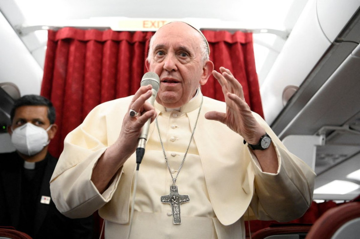 Pope Francis holds a news conference aboard the papal plane on his flight back after visiting Malta, April 3, 2022. Vatican Media/Â­Handout via REUTERS   