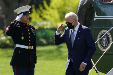U.S. President Joe Biden returns a salute as he steps from Marine One upon arrival at the White House in Washington, U.S., April 11, 2022. 