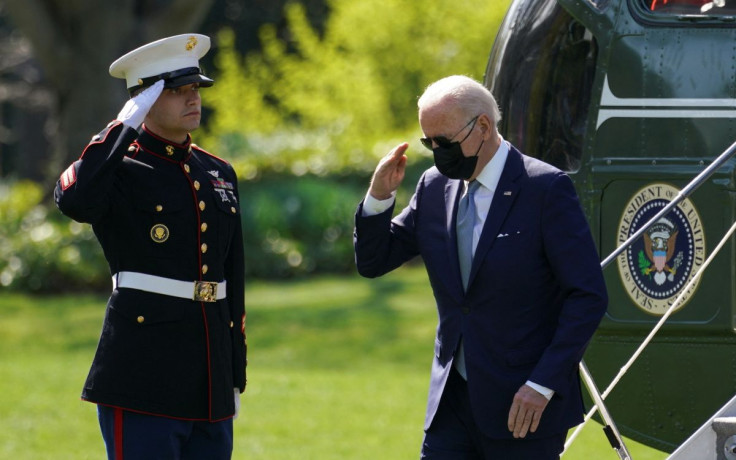 U.S. President Joe Biden returns a salute as he steps from Marine One upon arrival at the White House in Washington, U.S., April 11, 2022. 