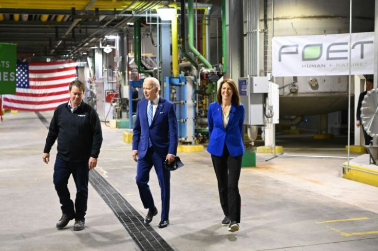 US President Joe Biden (center) alongside Democratic Iowa Congresswoman Cindy Axne (right) and Jack Mitchell, regional vice president of POET Bioprocessing, in Menlo, Iowa on April 12, 2022