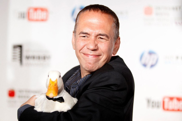 Comedian Gilbert Gottfried arrives with a duck at the Webby Awards in New York June 14, 2010. 