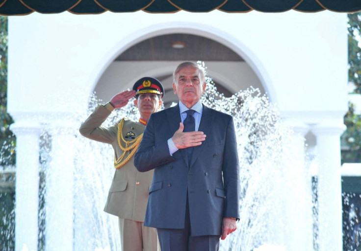 Pakistan's Prime Minister Shehbaz Sharif gestures during the guard of honour ceremony at the Prime Minister house in Islamabad, Pakistan April 12, 2022. Press Information Department (PID) Handout via REUTERS