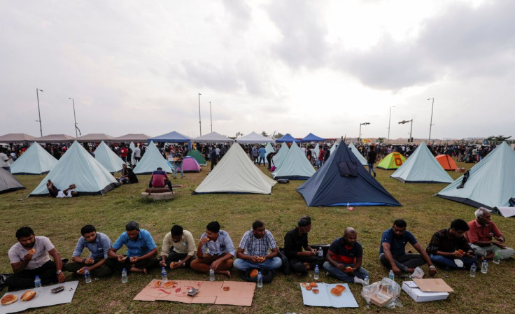 Muslim demonstrators eat Iftar meal inside a protest area, dubbed the Gota-Go village, where people are gathering in opposition to Sri Lanka's President Gotabaya Rajapaksa near the Presidential Secretariat, amid the country's economic crisis, in Colombo,