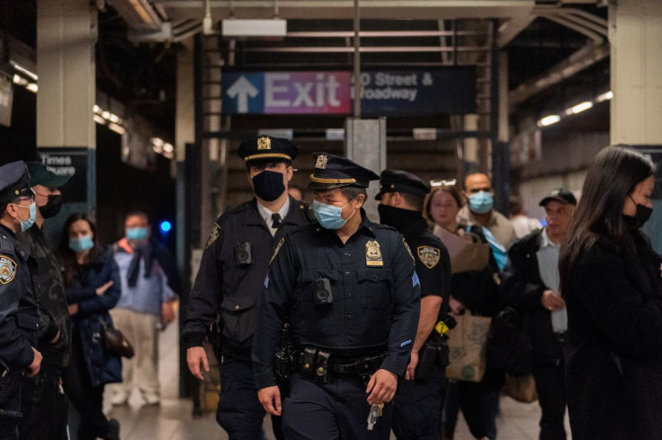 Police officers patrol in Times Square station, after a shooting at a subway station in Brooklyn borough, in Manhattan, New York City, New York, U.S., April 12, 2022. 