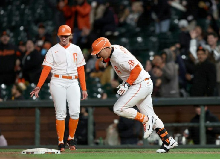 San Francisco Giants coach Alyssa Nakken (left) became the first woman to coach on-field during a Major League Baseball game on Tuesday