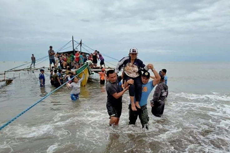 Tropical storm Megi has unleashed floods and landslides in the Philippines, killing dozens of people