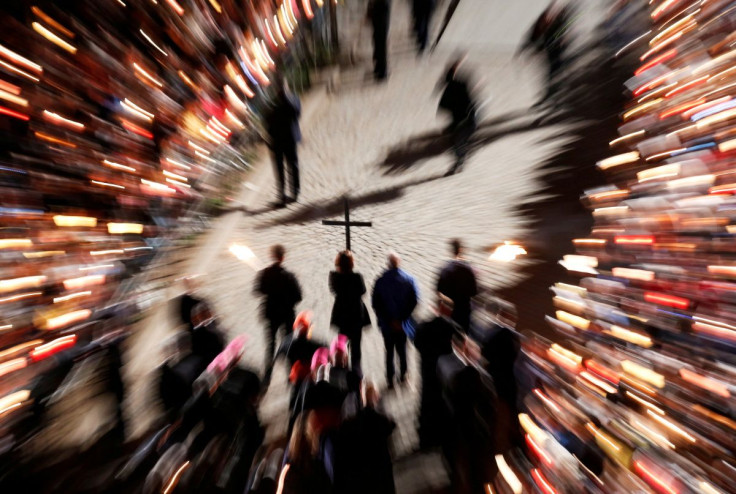 People take part in the Via Crucis (Way of the Cross) procession led by Pope Francis during Good Friday celebrations at Rome's Colosseum, Rome, Italy April 19, 2019. 