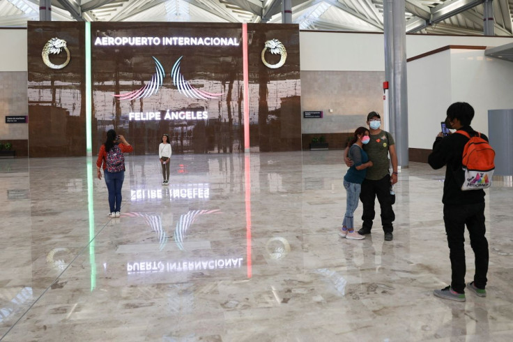 People take photos of themselves at an area of the new Felipe Angeles international airport, in Zumpango, Mexico State, Mexico, April 1, 2022. Picture taken April 1, 2022.
