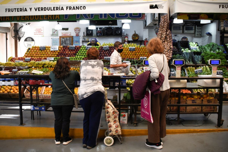 Customers line up to buy produce in a market as inflation in Argentina hits its highest level in years, causing food prices to spiral, in Buenos Aires, Argentina April 12, 2022.  