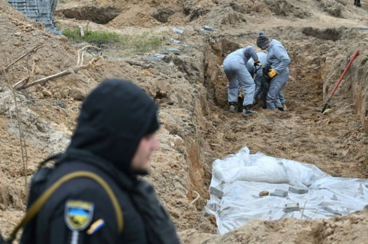 Bodies being exhumed from a mass-grave in Bucha