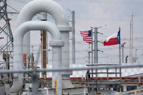 A maze of crude oil pipe and equipment is seen with the American and Texas flags flying in the background during a tour by the Department of Energy at the Strategic Petroleum Reserve in Freeport, Texas, U.S. June 9, 2016.  