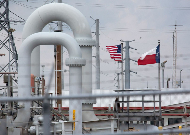 A maze of crude oil pipe and equipment is seen with the American and Texas flags flying in the background during a tour by the Department of Energy at the Strategic Petroleum Reserve in Freeport, Texas, U.S. June 9, 2016.  