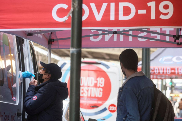 A man is given a coronavirus disease (COVID-19) test at pop-up testing site in New York City, U.S., April 11, 2022.  