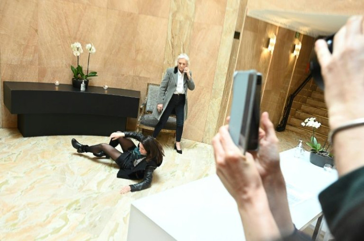 The far-right leader has sought to project a more moderate image in this campaign but tensions were exposed when her security tackled a female protester to the floor and then dragged out by the arm.