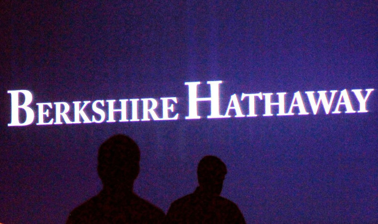 Berkshire Hathaway shareholders walk by a video screen at the company's annual meeting in Omaha May 4, 2013. 