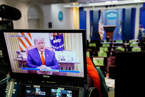 A pre-recorded video of U.S. President Donald Trump addressing the U.S. Capitol riot is seen playing on a television in the White House briefing room in Washington, U.S., January 13, 2021. 