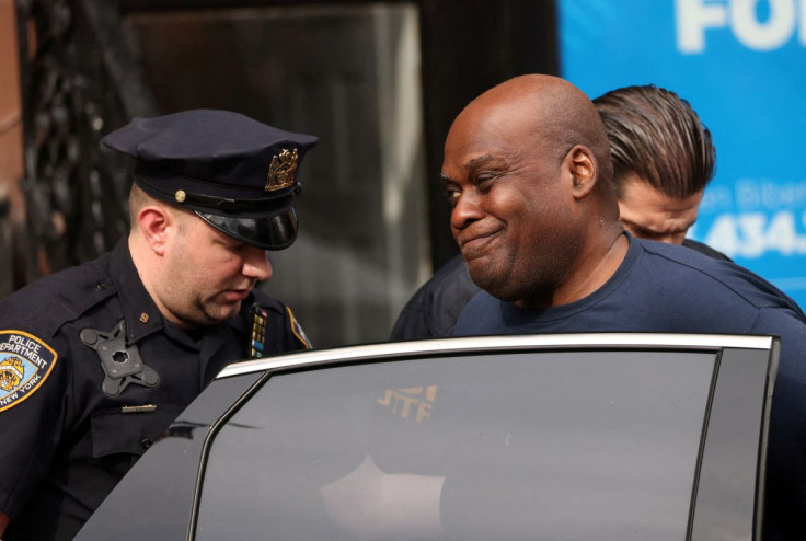 Frank James, the suspect in the Brooklyn subway shooting walks outside a police precinct in New York City, New York, U.S., April 13, 2022. 