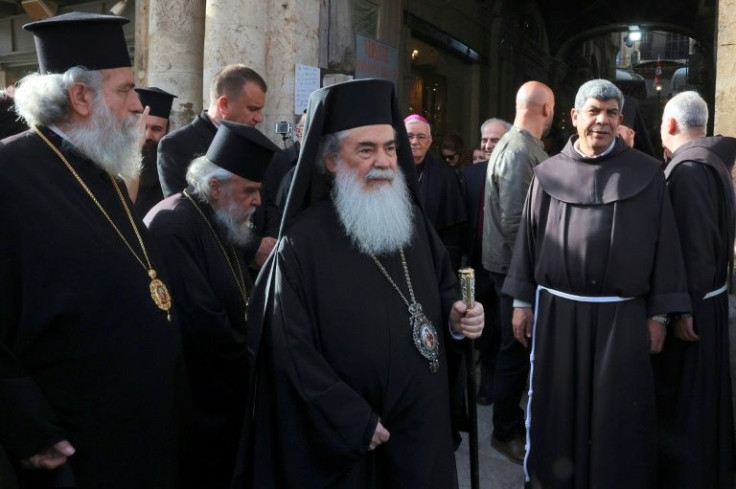 The Greek Orthodox Patriarch of Jerusalem Theophilos III (C) arrives for a meeting with other religious leaders at the Petra Hotel at the Jaffa Gate area in Jerusalem's old city