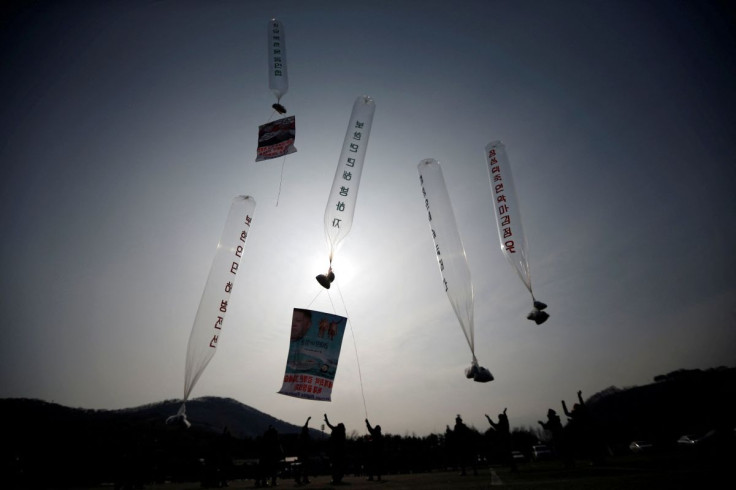 Former North Korean defectors living in South Korea, release balloons containing one dollar banknotes, radios, CDs and leaflets denouncing the North Korean regime, towards the north near the demilitarized zone which separates the two Koreas in Paju, north