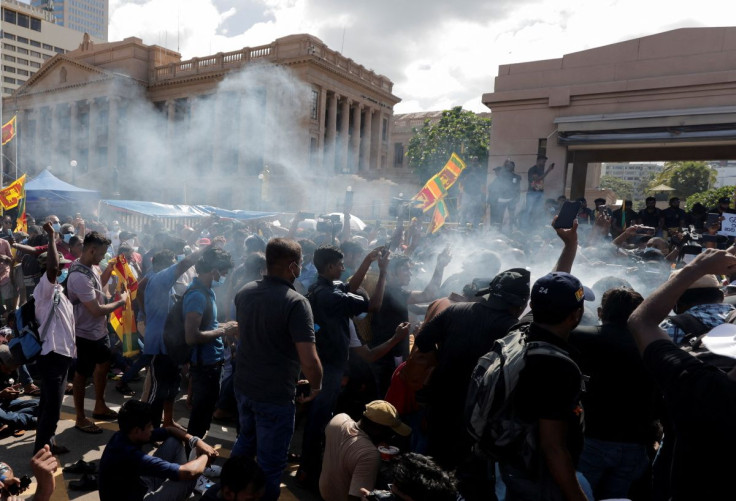 Demonstrators take part in a ritual of boiling milk to mark the Shinala and Tamil new year during their protest against Sri Lankan President Gotabaya Rajapaksa in front of the Presidential secretariat, amid the country's economic crisis in Colombo, Sri La