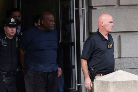 Frank James, the suspect in the Brooklyn subway shooting, is escorted from an NYPD precinct in Manhattan, New York City, U.S., April 13, 2022. 