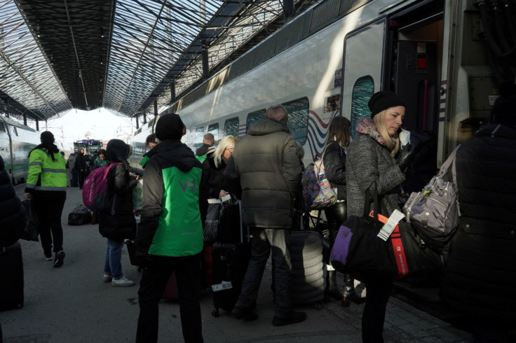 People board the Allegro, a train that runs between Finnish capital Helsinki and the Russian city of Saint Petersburg, amid Russia's invasion of Ukraine, at the central railway station in Helsinki, Finland March 5, 2022. Picture taken March 5, 2022.