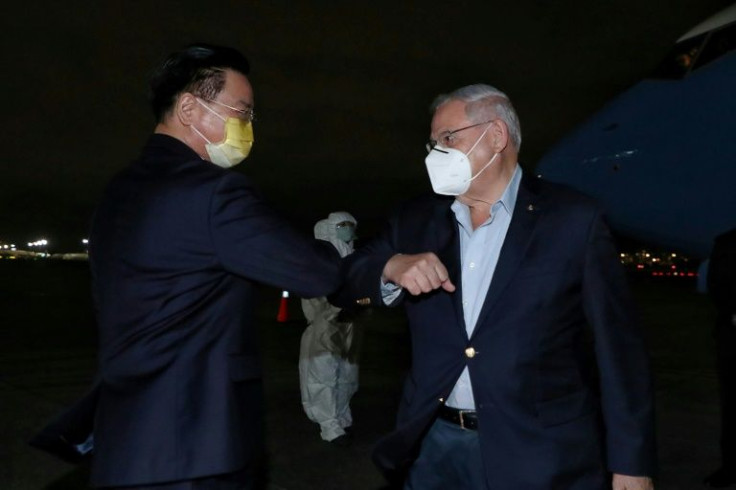 Visiting US senator Bob Menendez (R) is greeted by Taiwan's foreign minister Joseph Wu in Taipei
