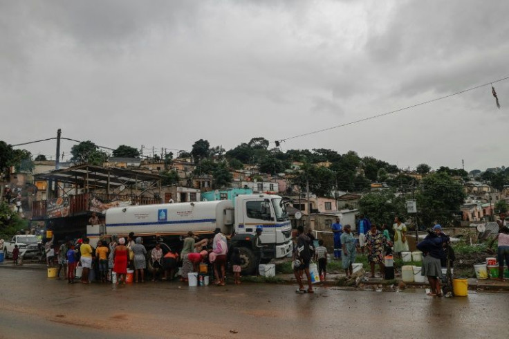 People have pressed ahead, using muddy river water to wash the clothes and linens they were able to dig out of their homes