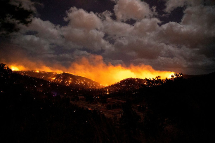 The McBride Fire burns in the heart of the village in Ruidoso, New Mexico, United States, April 12, 2022. Ivan Pierre Aguirre/USA Today Network via REUTERS