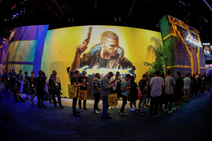 Attendees wait in line at the Cyberpunk 2077 booth during the opening day of E3, the annual video games expo revealing the latest in gaming software and hardware in Los Angeles, California, U.S., June 11, 2019. 