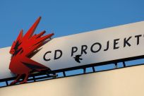 A bird flies in front of the Cd Projekt logo at its headquarters in Warsaw, Poland January 21, 2020. Picture taken January 21, 2020. 