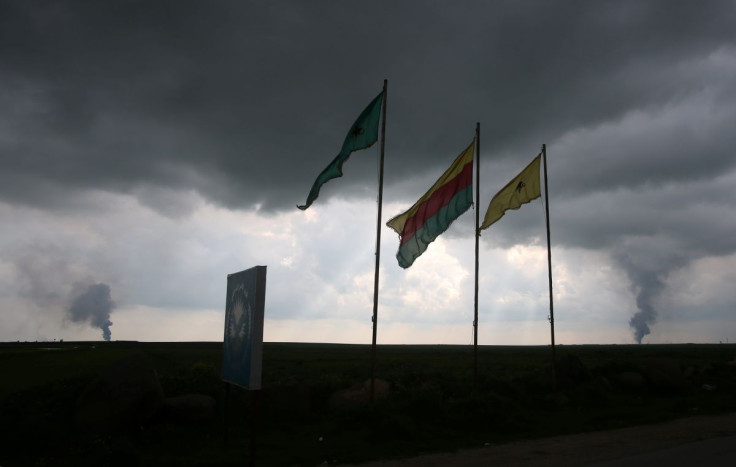 Kurdish People's Protection Units (YPG) and Kurdish female fighters of the Women's Protection Unit (YPJ) flags flutter in Hasaka governorate, Syria March 28, 2019. Picture taken March 28, 2019.