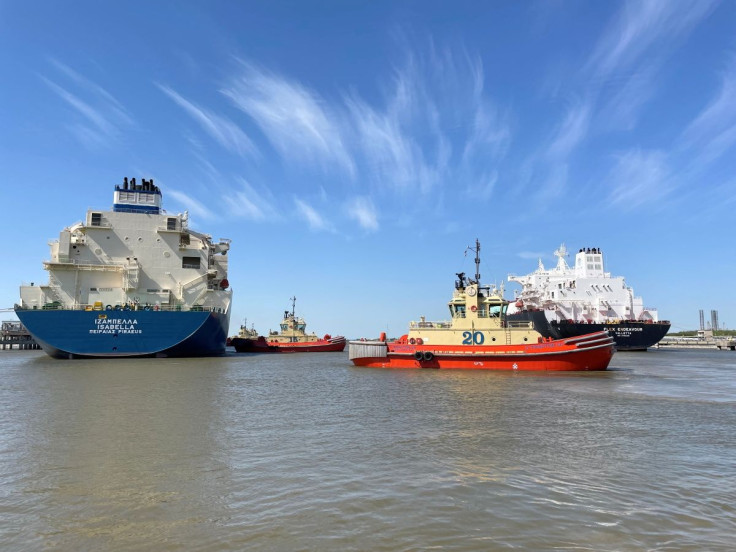 An LNG tanker is guided by tug boats at the Cheniere Sabine Pass LNG export unit in Cameron Parish, Louisiana, U.S., April 14, 2022.