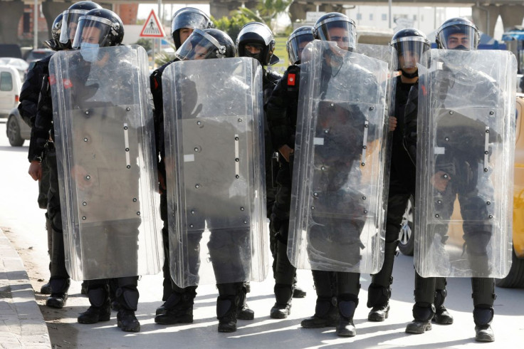 Members of the police stand guard during an anti-government protest in Tunis, Tunisia January 26, 2021.