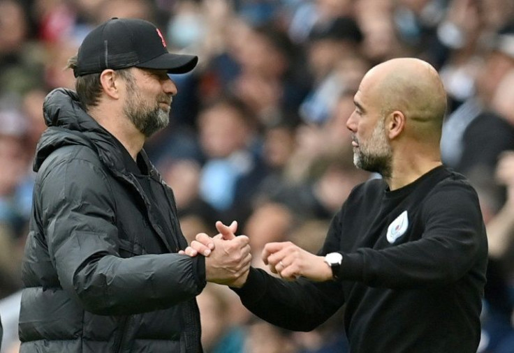 Liverpool manager Jurgen Klopp (left) is preparing to go head to head again with Manchester City boss Pep Guardiola