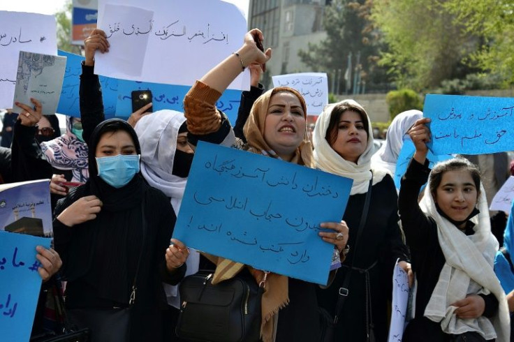 Afghan women and girls protest in front of the Ministry of Education in Kabul in March 2022, demanding high schools be reopened